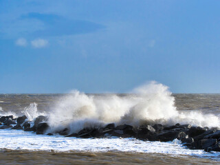 Stormy waves crashing over the Cobb seawall at Lyme Regis at the tail end of Storm Ciarán