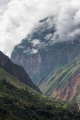 Spectacular and amazing beautiful panorama of the Andes Mountains in the Colca Canyon, Peru. White clouds. HDR.