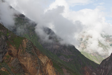 Spectacular and amazing beautiful panorama of the Andes Mountains in the Colca Canyon, Peru. White clouds, wonderful cloudscape. Cliff, blue sky. HDR