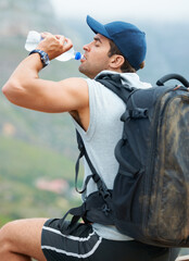 Man, hiking and drinking water in nature rest for fitness, exercise and workout in Brazil...