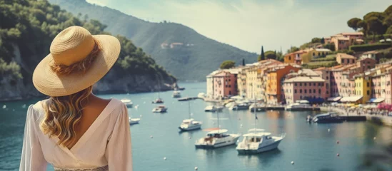  Tourist girl enjoying view of picturesque village in Portofino Italy copy space image © vxnaghiyev