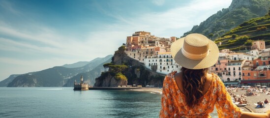 Tourist girl admires stunning Amalfi Coast in Italy copy space image