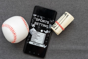 smartphone, money and rugby ball on light background. Concept of sports bet
