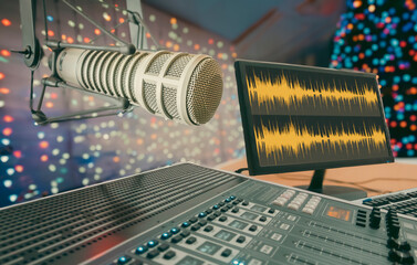 professional microphone and mixer in radio studio with christmas decor