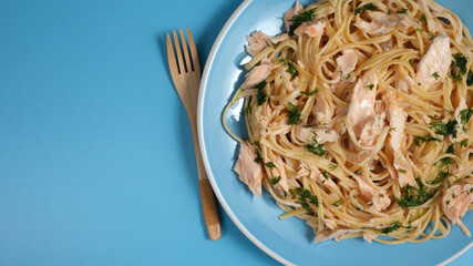 Creamy Salmon Pasta on ceramic plate.