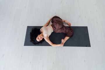Woman doing yoga exercises asana gymnastics fitness