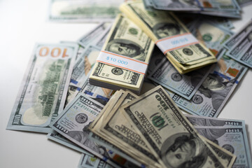 Cash money in a large pile as a finance background. Paper money close up. Top view.