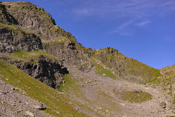 High and rocky mountains in the summer season. Landscape with the wild Carpathians of Romania