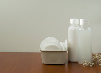 Cosmetic products and cotton pads.White cosmetic bottle mockup. Skin care concept.