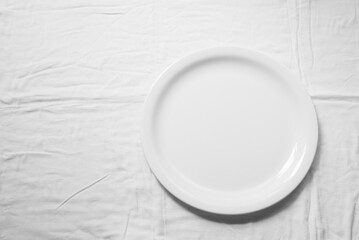 White ceramic plate isolated on a white background