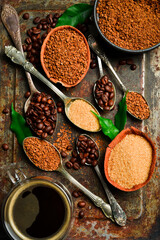 Coffee background. Assortment of instant and brewed coffee beans. On a metallic rusty background.
