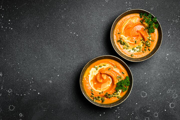 Two bowls of pumpkin soup. Pumpkin Autumn Healthy Food Nutrition Seasonal Vegetable Concept. Autumn...