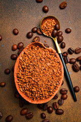 Instant coffee in a wooden bowl. Coffee background. Free space for text.