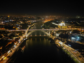 Portugal, Porto, Ponte Luis I Bridge, night aerial photo from drone