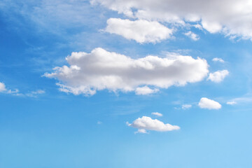 Blue sky with white fluffy cloud. Cumulus clouds background. Cloudscape morning sky. The concepts of freedom of live, never give up and positive though energy.	
