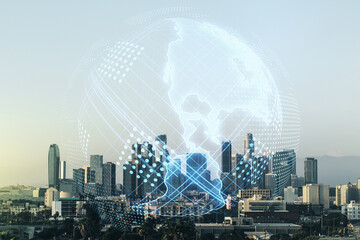 Double exposure of graphic America map hologram on Los Angeles office buildings background, big...
