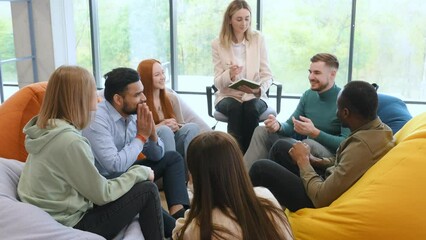 Diverse people talking sit in circle at group counseling therapy session concept, multiracial patients communicating sharing problems get support at rehab meeting.