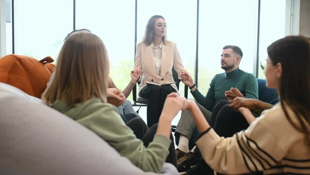 Diverse people talking sit in circle at group counseling therapy session concept, multiracial patients communicating sharing problems get support at rehab meeting.