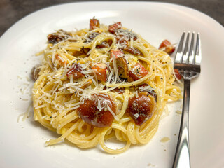 Spaghetti ala Carbonara with bacon, eggs, mushrooms and parmesan