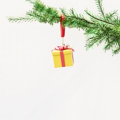 Closeup Gift box Christmas decoration hanging on Christmas tree on white background. 3D Rendering Christmas concept idea.
