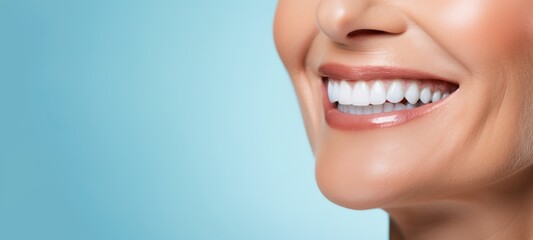 Obraz premium Teeth whitening, dentist treatment, dental health - Closeup of woman with beautiful smile and white teeth, isolated on blue background