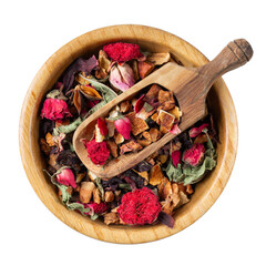 Dry herbal tea with fruits and flowers in wooden bowl isolated on white background. Top view.