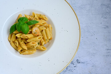  Italian home made   pennette pasta with smoked salmon , creamy sauce and fresh dill on wooden background