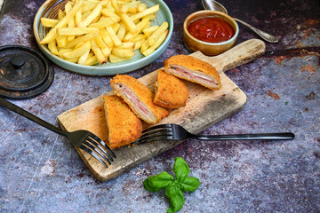  Crispy  deep fried home made     chicken Cordon bleu with cheese   and ham  and french fries on...