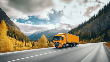 Truck driving on the asphalt road in rural landscape at sunset with dark clouds