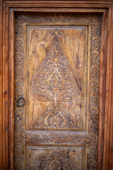 beautiful wooden carving with a ring shaped door knob, Khiva, the Khoresm agricultural oasis, Citadel.