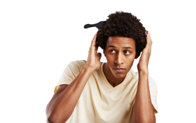 Man, looking and hair for grooming, brushing or care for style with comb in afro. Black person, male student and checking on cool, funky or retro hairstyle on isolated or transparent png background