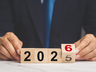 Flipping of 2025 to 2026 on wooden cubes for preparation of new year change