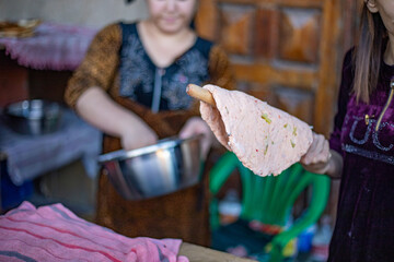 a traditional way of cooking bread in Central Asia Uzbekistan, Khiva, the Khoresm agricultural oasis, Citadel.