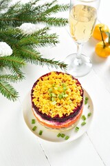 Christmas layered vegetable salad with herring and boiled vegetables
