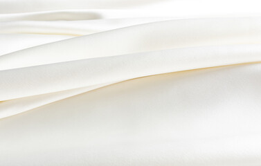 Elegant beige, champagne texture of satin fabric folds. A chic background for illustrations or...