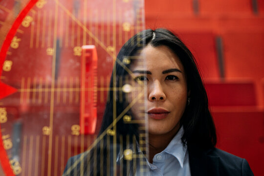 Businesswoman with large protractor in convention center