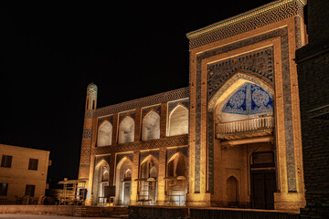 Naklejka premium beautiful Golden Glow from the historical building in the night time, Khiva, the Khoresm agricultural oasis, Citadel.