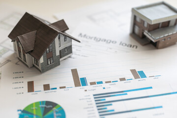 Volumetric project of house. Layout of a house with an open roof. Miniature layout of a cottage top view. Building model as a symbol of architectural business. Design in architectural bureau