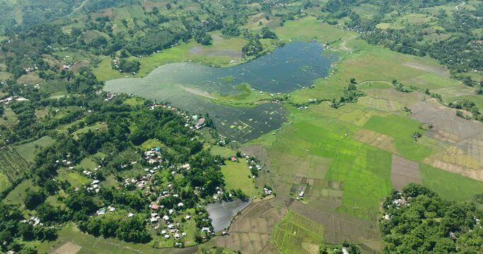 Beautiful landscape with agricultural fields around the Lake Seloton with fish farm. Lake Sebu. Mindanao, Philippines.