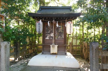 This is a shrine in Kyoto, Japan. It says "Shiramine Jingu" in Japanese.