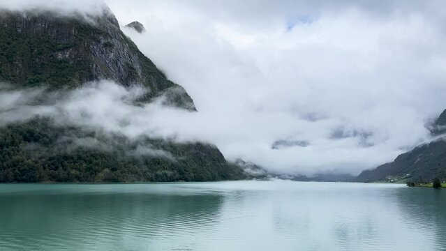 A scene of a very rainy day at Oldevatnet Lake and the Briksdal Valley, Norway