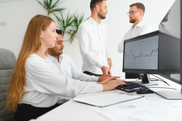 Obraz premium Team of brokers is working in office using workstation and analysis technology.