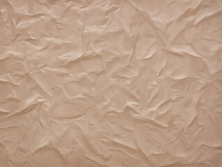 柔らかにシワを寄せた古紙や古布みたいな茶色い背景