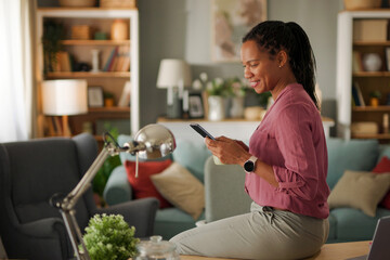 Businesswoman working from home office using smart phone