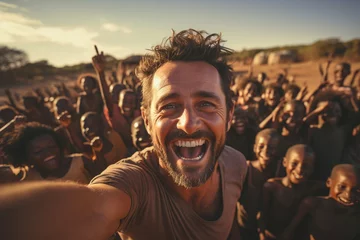 Zelfklevend Fotobehang Caucasian volunteer man in africa village takes a selfie with children - Volunteering concept - Human community - Generative AI © Davide Angelini