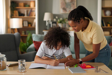 Mom helping a teenage son study for exam at home