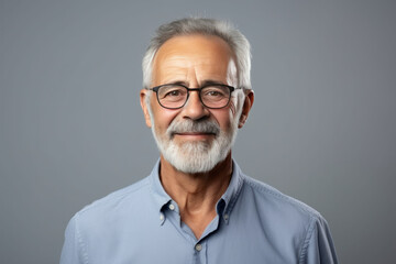 Fototapeta premium Portrait of a handsome senior man with grey hair and glasses.