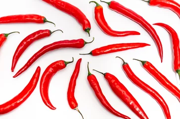 Foto op Canvas Hot chili pepper circle long shape on white background. Many pods in a symmetrical pattern. © romankrykh