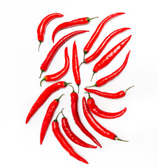 Obraz premium Hot chili pepper circle long shape on white background. Many pods in a symmetrical pattern.
