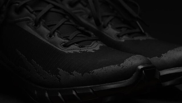 Black running sneakers. Suitable for shoe advertising.